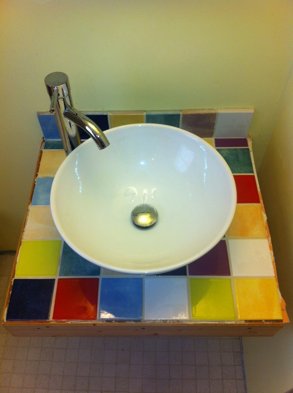 Siri's fun tile work under the (new) bathroom sink.