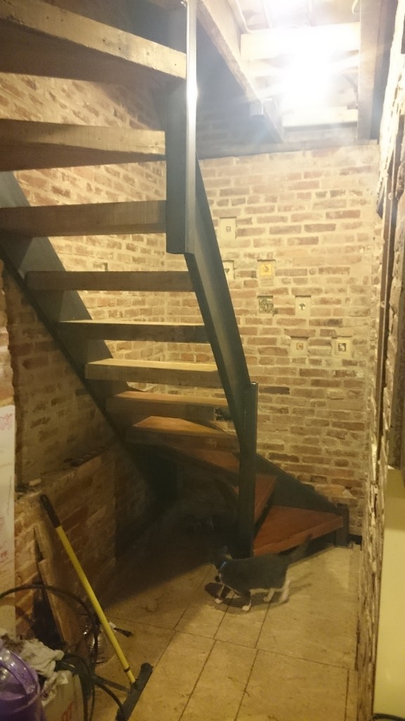 Emi inspects the stairs for violations.